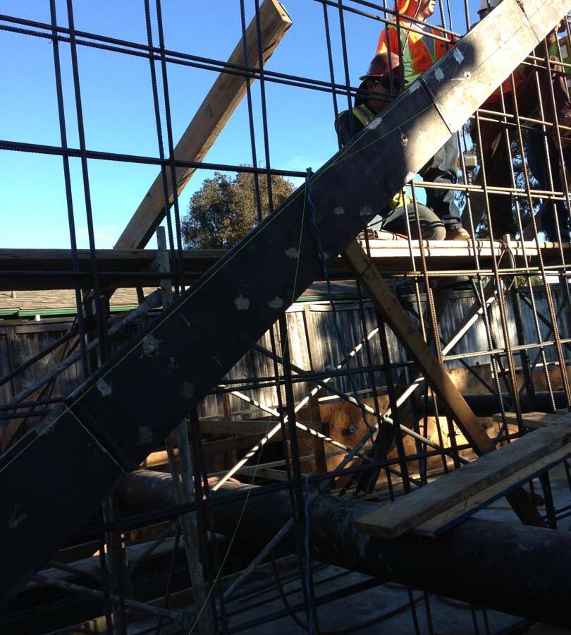 Pacificland’s iron men tieing all steel rebar reinforcement. Pacificland Constructors