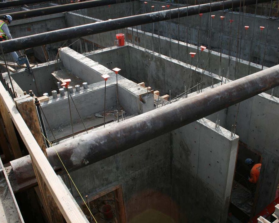 New solid concrete shear walls holding the 1st floor above the basement. Pacificland Constructors