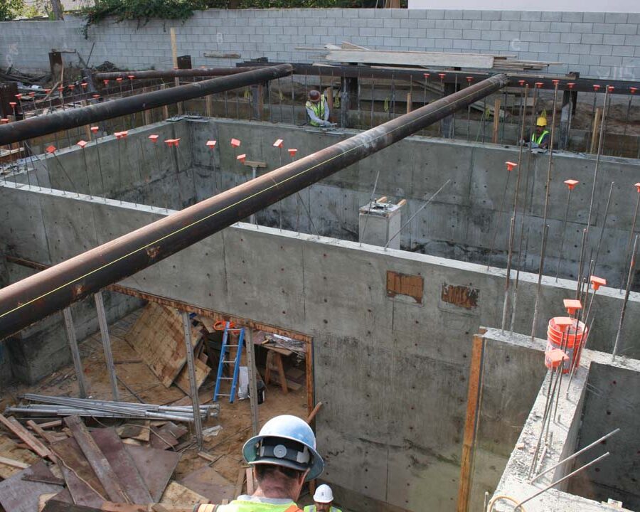 New solid concrete shear walls and retaining walls holding the 1st floor above the basement. Pacificland Constructors