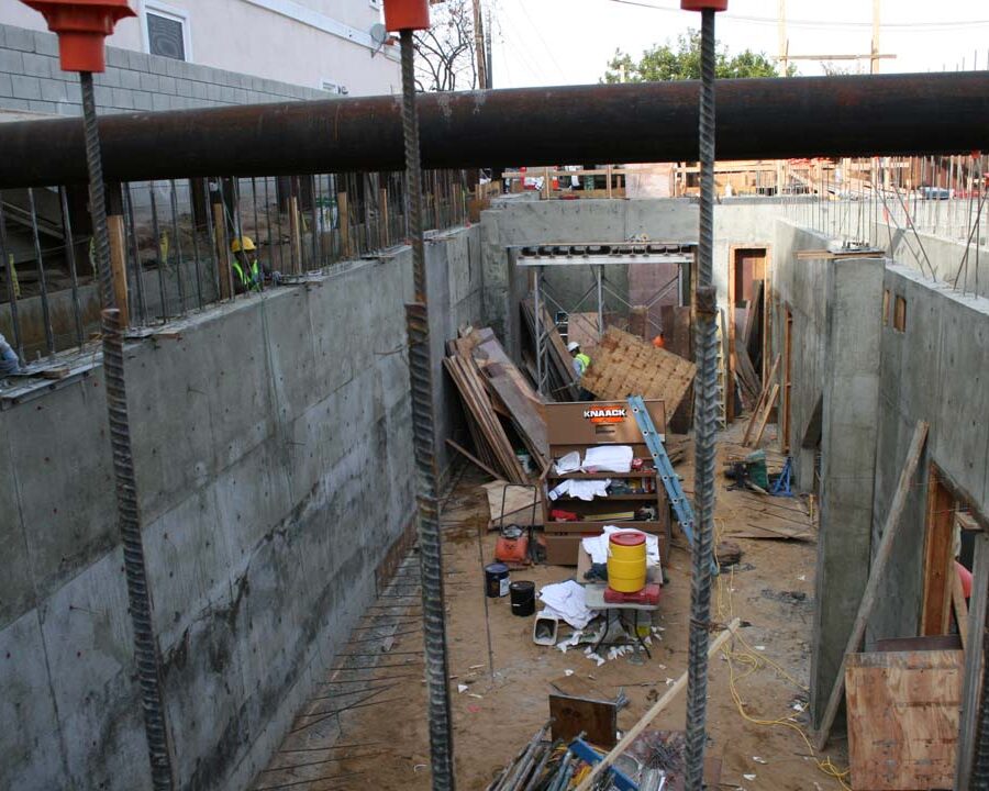 New solid concrete shear walls and retaining walls holding the 1st floor above the basement. Pacificland Constructors