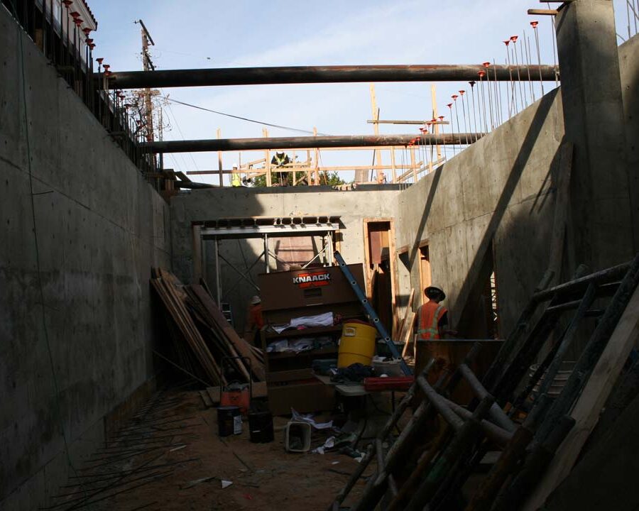 New solid concrete shear walls and retaining walls holding the 1st floor above the basement. Pacificland Constructors