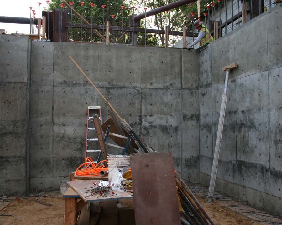 New solid concrete shear walls and retaining walls holding the 1st floor above the basement. Pacificland Constructors