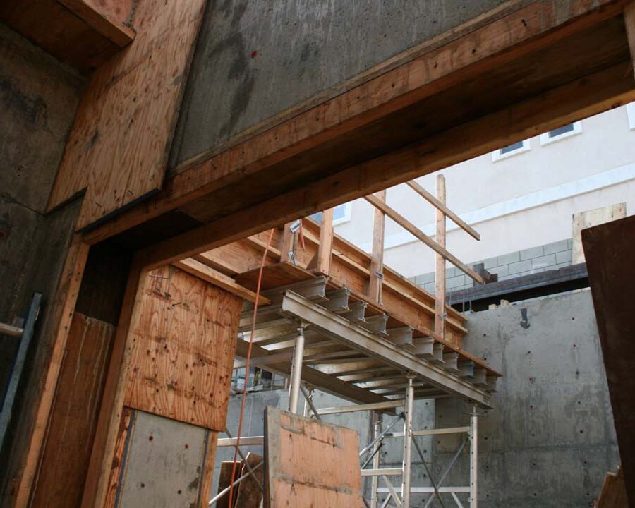 New solid concrete shear walls and retaining walls holding the 1st floor above the basement. Pacificland Constructors