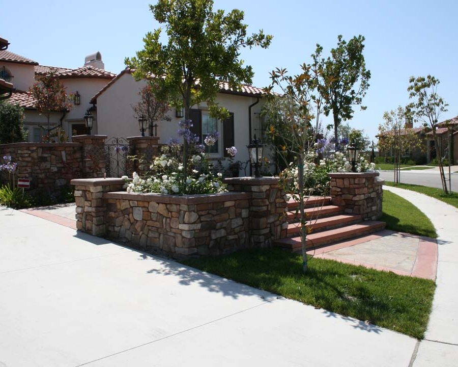 New stone veneer on the main entrance solidifies the Spanish architectural theme of the home.