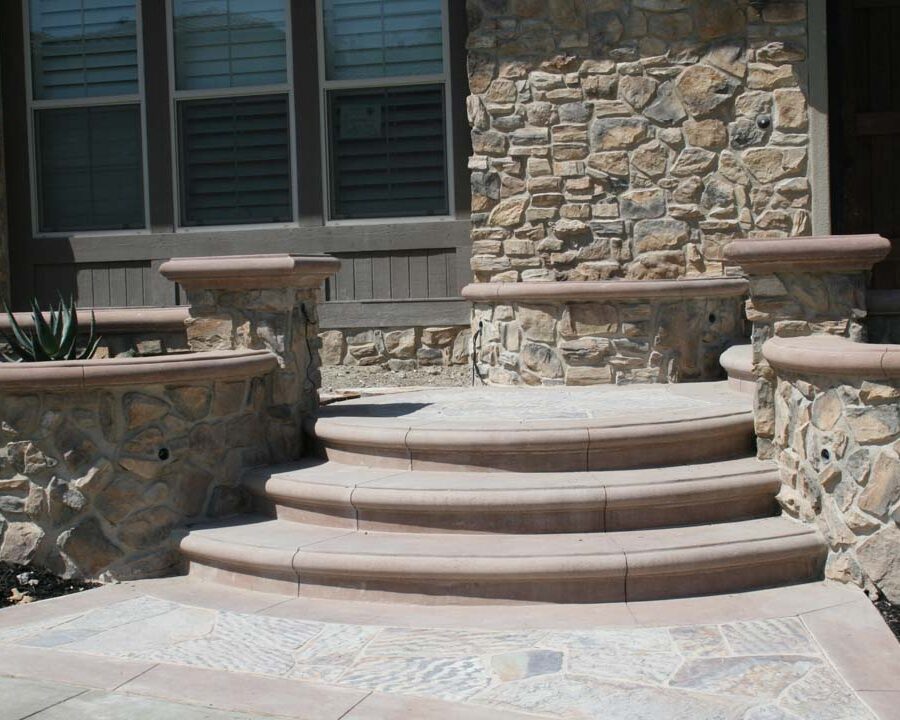 New natural stone veneer on the main entrance of the home creates an architecturally bold and vintage look. Pacificland Constructors