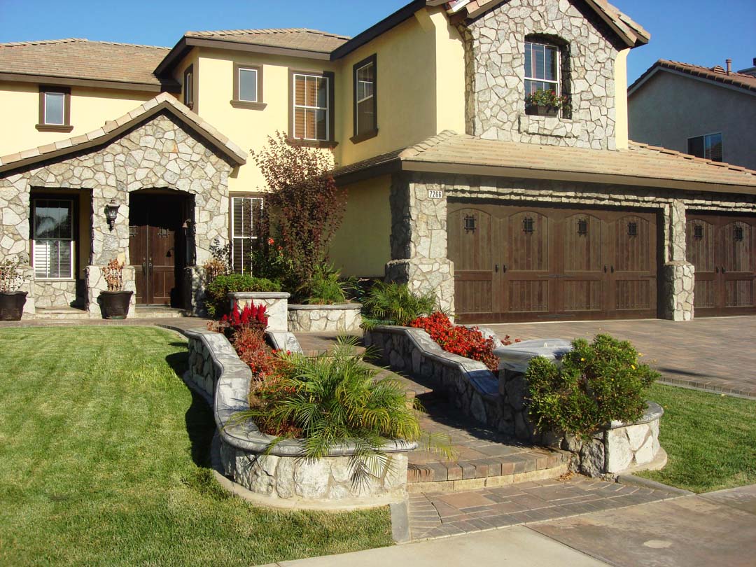 Existing stucco was removed and replaced with new stone veneer to give the home an architecturally vintage look. The existing chimney was repaired, reinforced, and flagstone veneer was used to match the vintage theme. Pacificland Constructors