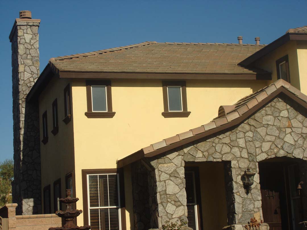 Existing stucco was removed and replaced with new stone veneer to give the home an architecturally vintage look. The existing chimney was repaired, reinforced, and flagstone veneer was used to match the vintage theme. Pacificland Constructors