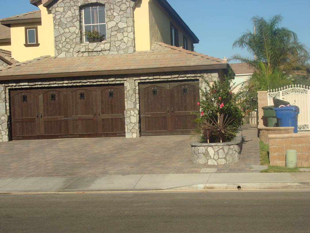 Existing stucco was removed and replaced with new stone veneer to give the home an architecturally vintage look. New planters with concrete precast wall caps match are used to match the vintage theme. Pacificland Constructors