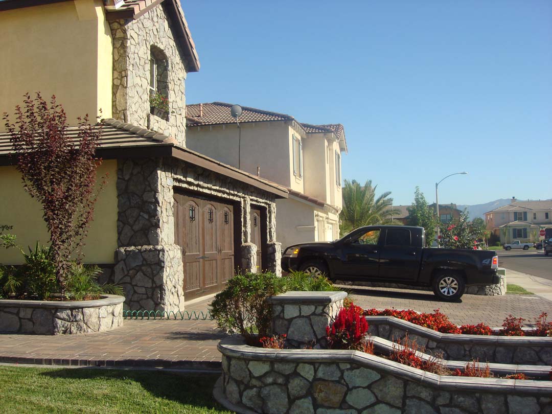 Existing stucco was removed and replaced with new stone masonry to give the home an architecturally vintage look. Pacificland Constructors