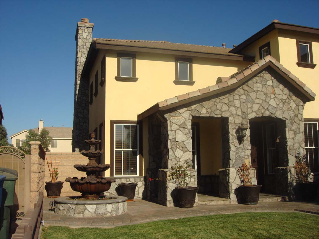 Existing stucco was removed and replaced with new stone masonry to give the home an architecturally vintage look. Pacificland Constructors