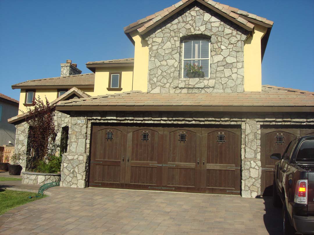 New stone veneer on the face of new concrete steps. Pacificland Constructors