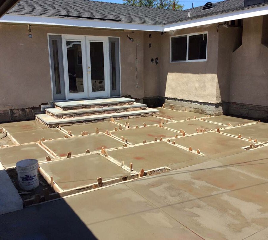 New concrete backyard patio with an architecturally nature-friendly theme. Pacificland Constructors