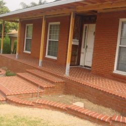 New raised porch and brick planters. This raised new porch has brick veneer and pattern. We installed CB44’s for a new covered porch as shown. Pacificland Constructors