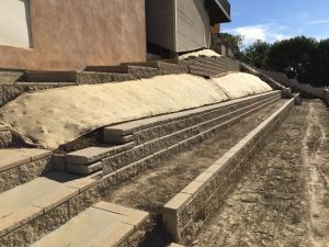 New colored wall without motar for a backyard.