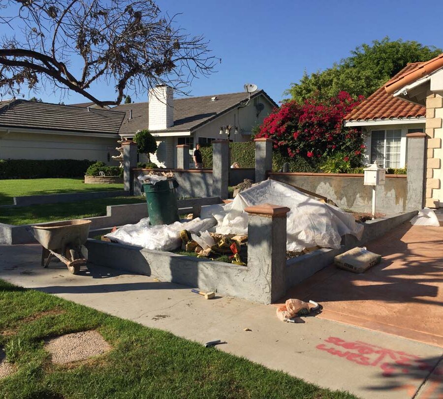 Stucco coating over CMU pilasters and walls for the a courtyard entrance of a home in Cerritos, CA.