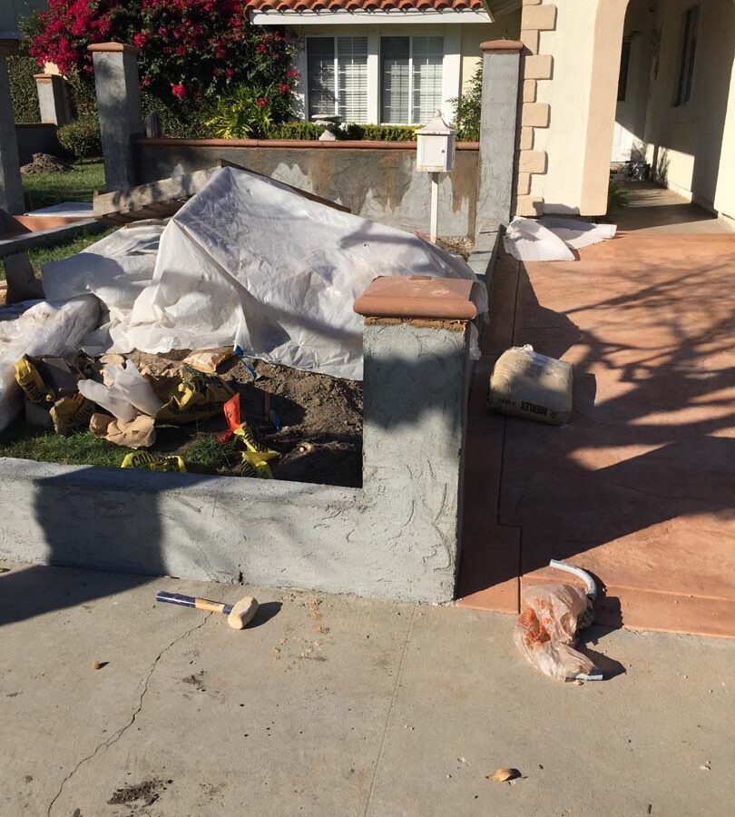 Stucco coating over CMU pilasters and walls for the a courtyard entrance of a home in Cerritos, CA.