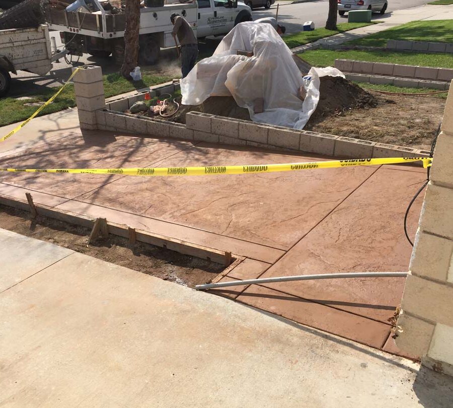 New CMU courtyard in Cerritos, CA. This will have a colored stucco coat so it contrasts with the stamped colored concrete.