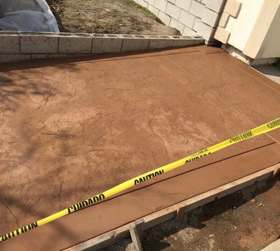 New CMU courtyard in Cerritos, CA. This will have a colored stucco coat so it contrasts with the stamped colored concrete.