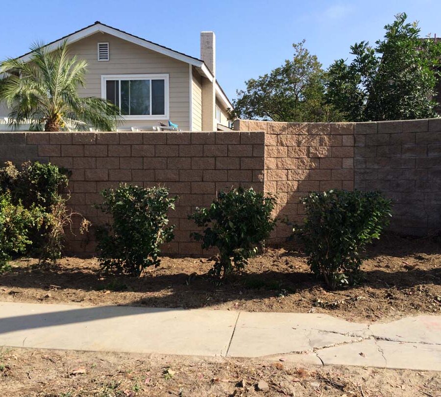 New curved split-faced-block freestanding wall for public works. Pacificland Constructors