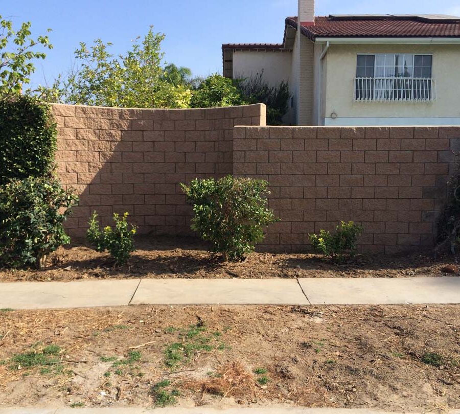 New curved split-faced-block freestanding wall for public works. Pacificland Constructors