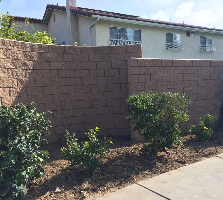 New curved split-faced-block freestanding wall for public works. Pacificland Constructors