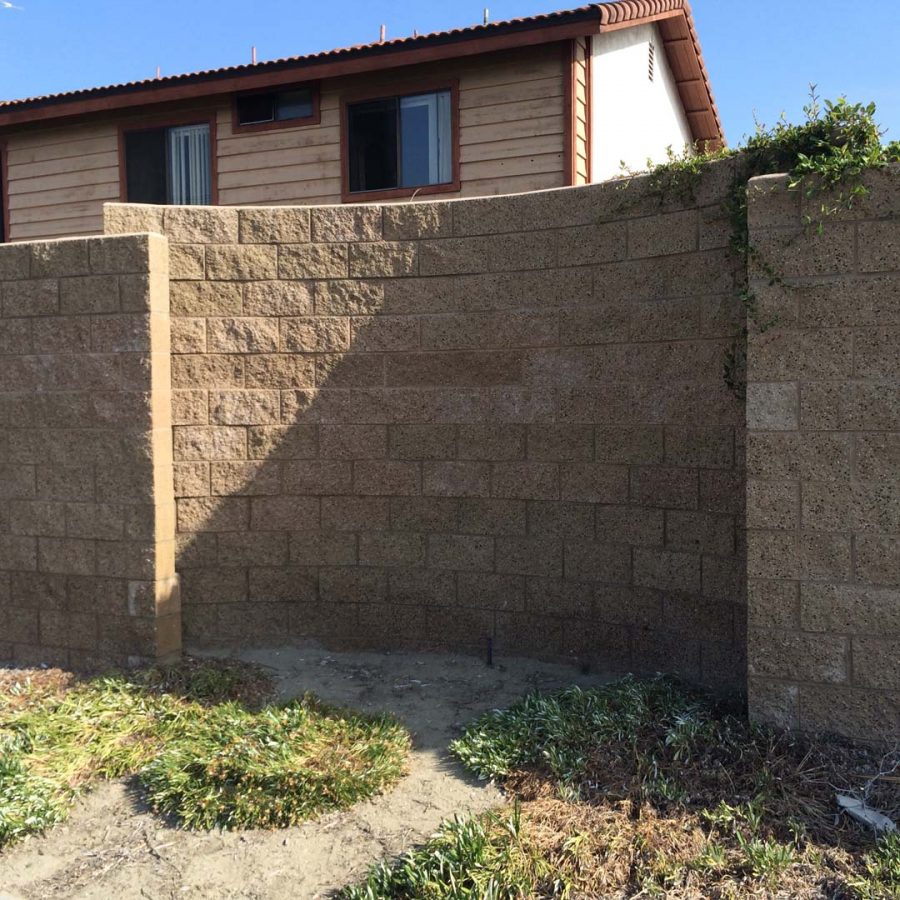 New curved split-faced-block freestanding wall for public works. Pacificland Constructors