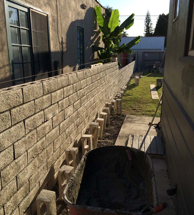 Construction of a new slump block wall for a home’s side yard. This is a great option to raise the value of your home and create more private living space. Pacificland Constructors