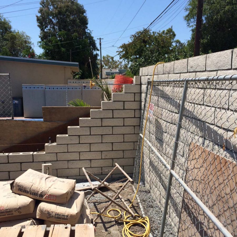 Construction of a new slump block wall for a home’s side yard. This is a great option to raise the value of your home and create more private living space. Pacificland Constructors