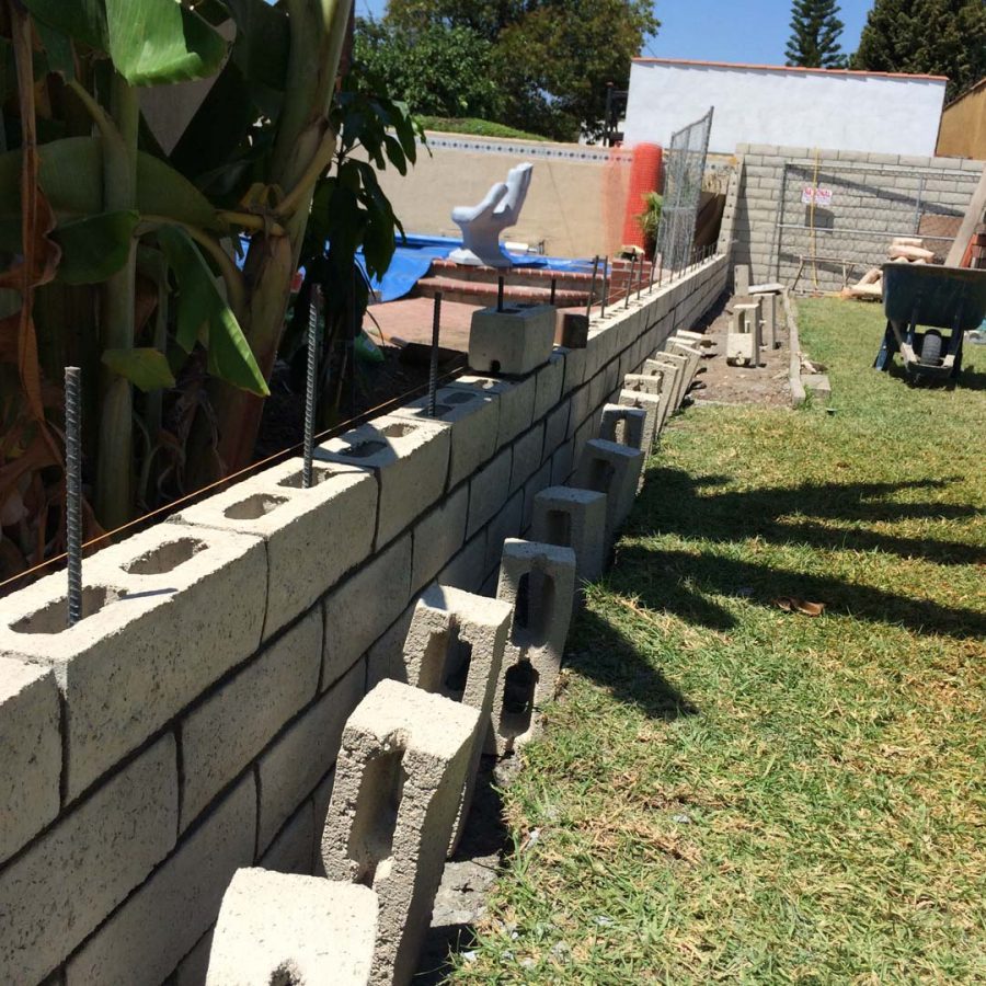 Construction of a new slump block wall for a home’s side yard. This is a great option to raise the value of your home and create more private living space. Pacificland Constructors