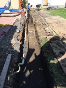 New strip footing for a new slump block wall for a home’s side yard. Iron-men will now tie steel reinforcement for this wall. Pacificland Constructors