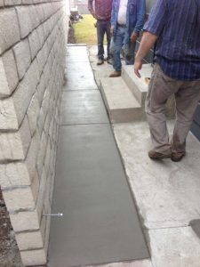 The owner wanted to keep his existing sidewalk and only extend it to the wall for this reason the entire sidewalk was not poured. Pacificland Constructors