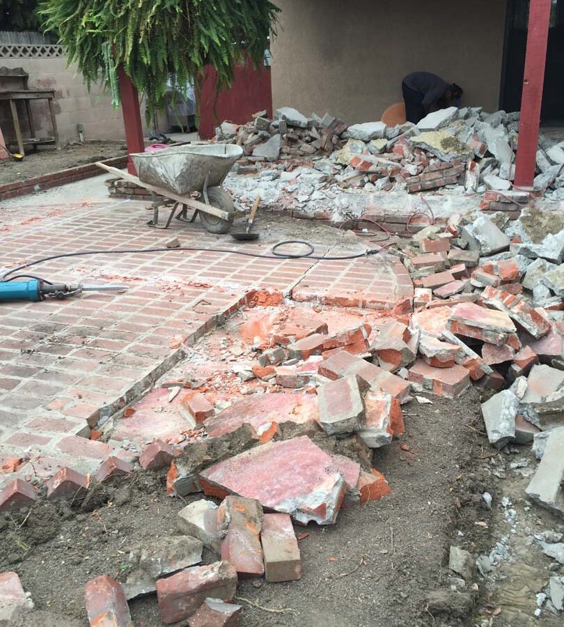 Demolition of the old backyard patio.