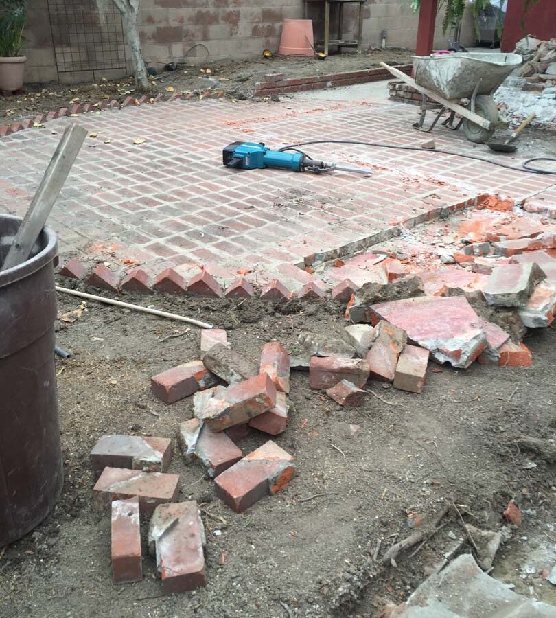 Demolition of the old backyard patio.