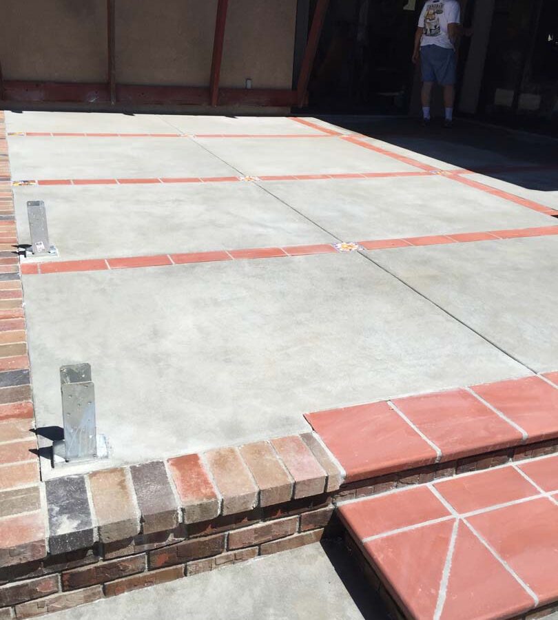 New brick steps, ribbons, and concrete flatwork. Pacificland Constructors