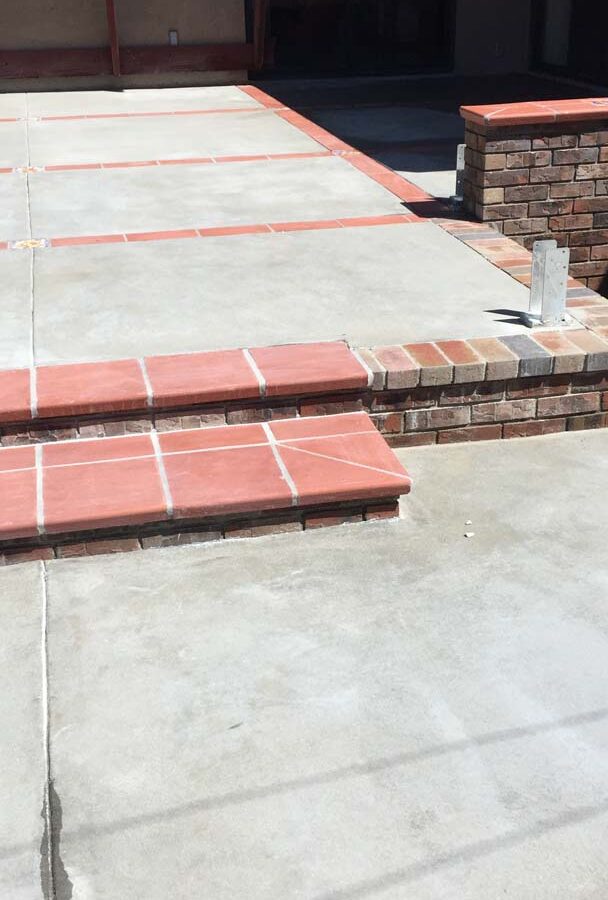 New brick steps, ribbons, and concrete flatwork. Pacificland Constructors