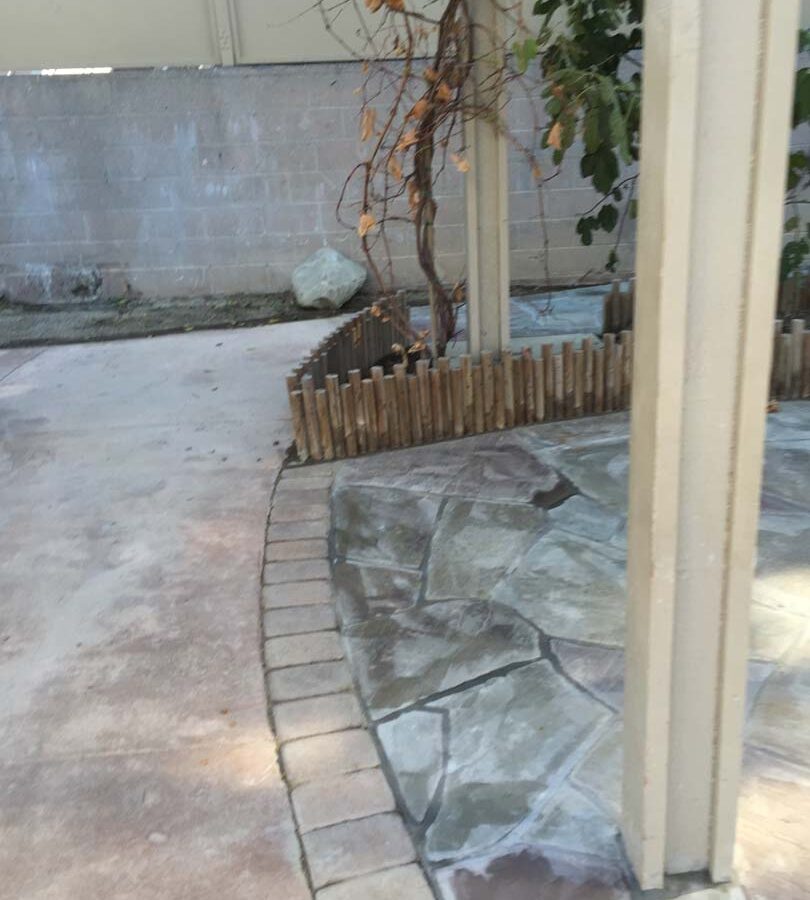 New flagstone patio gives the home a relaxing theme.