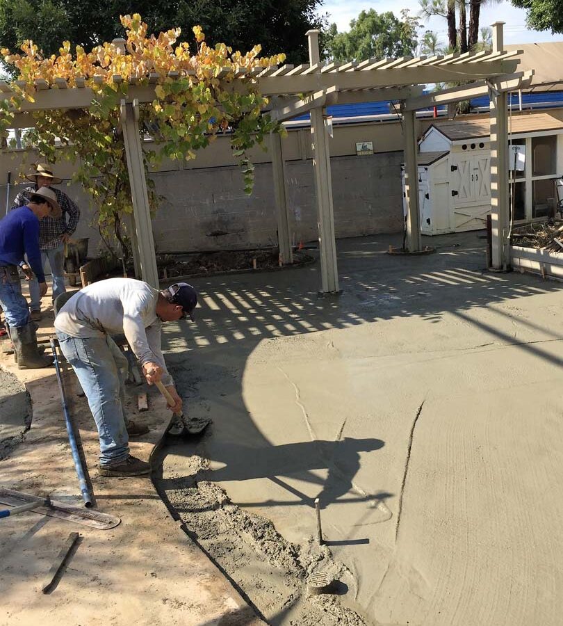 Pouring of a new patio foundation for new pavers. Pacificland Constructors