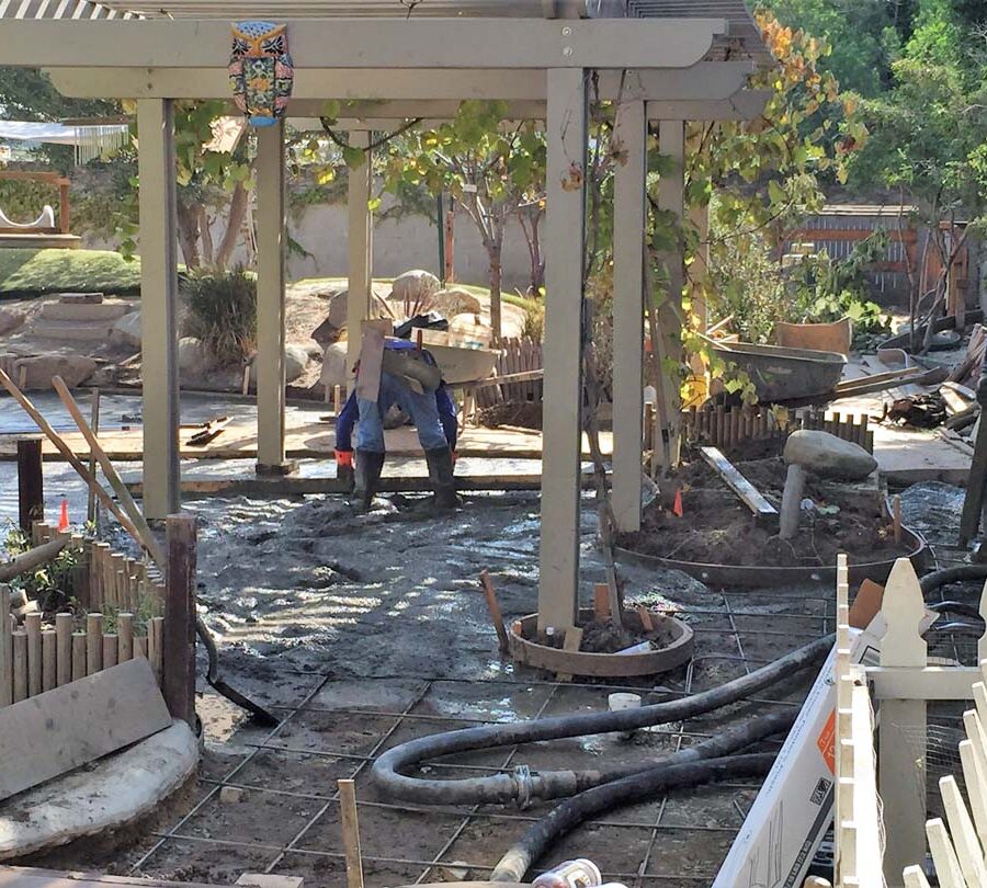 Pouring of a new patio foundation for new pavers. Pacificland Constructors