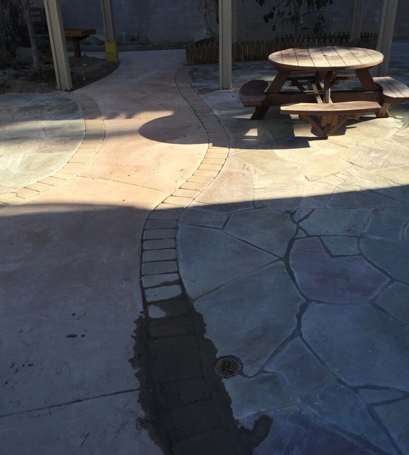 Flagstone patio gives the home a relaxing theme. Pacificland Constructors