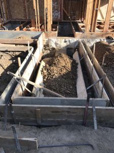 Construction framing for a new home addition in Lakewood, CA. Forming of Stem wall foundation and steps.