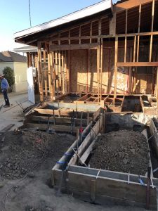 Construction for a new home addition in Lakewood, CA. Forming of Stem wall foundation. Pacificland Constructors