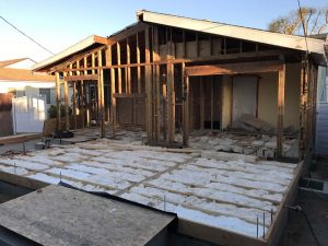 Rough framing and insulation installation for a home addition in Lakewood, CA. Pacificland Constructors