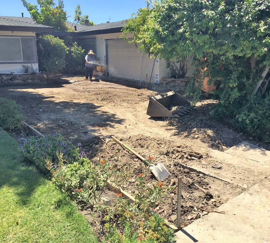 Grading for a new front yard patio with gaps used to create an architecturally nature-friendly theme. Pacificland Constructors