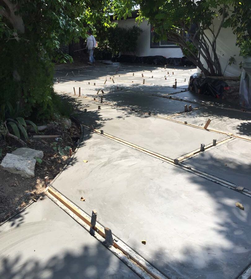 Construction of a new front yard patio used to create an architecturally nature-friendly theme. Pacificland Constructors