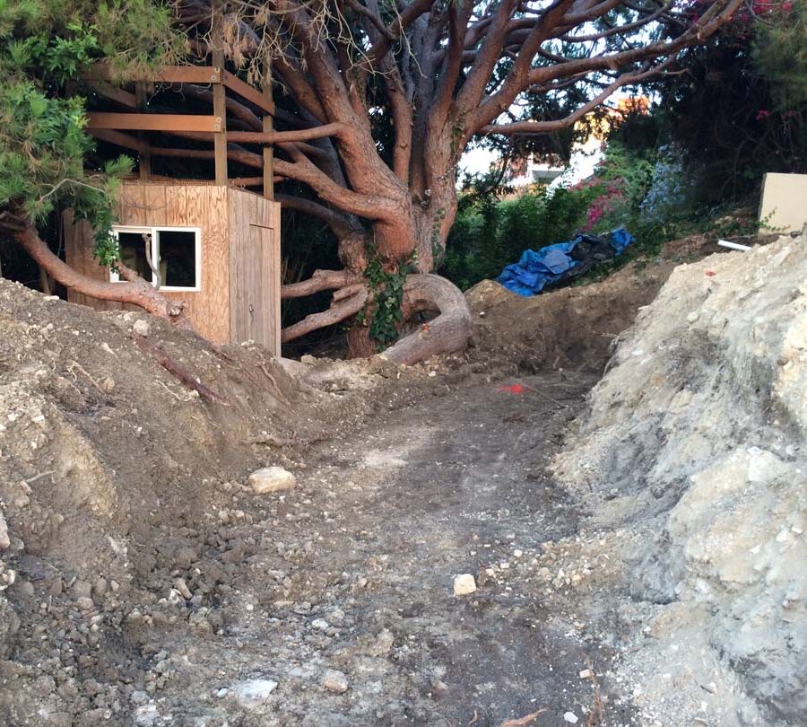 Preparing the area that will serve as the new retaining wall’s foundation. Pacificland Constructors