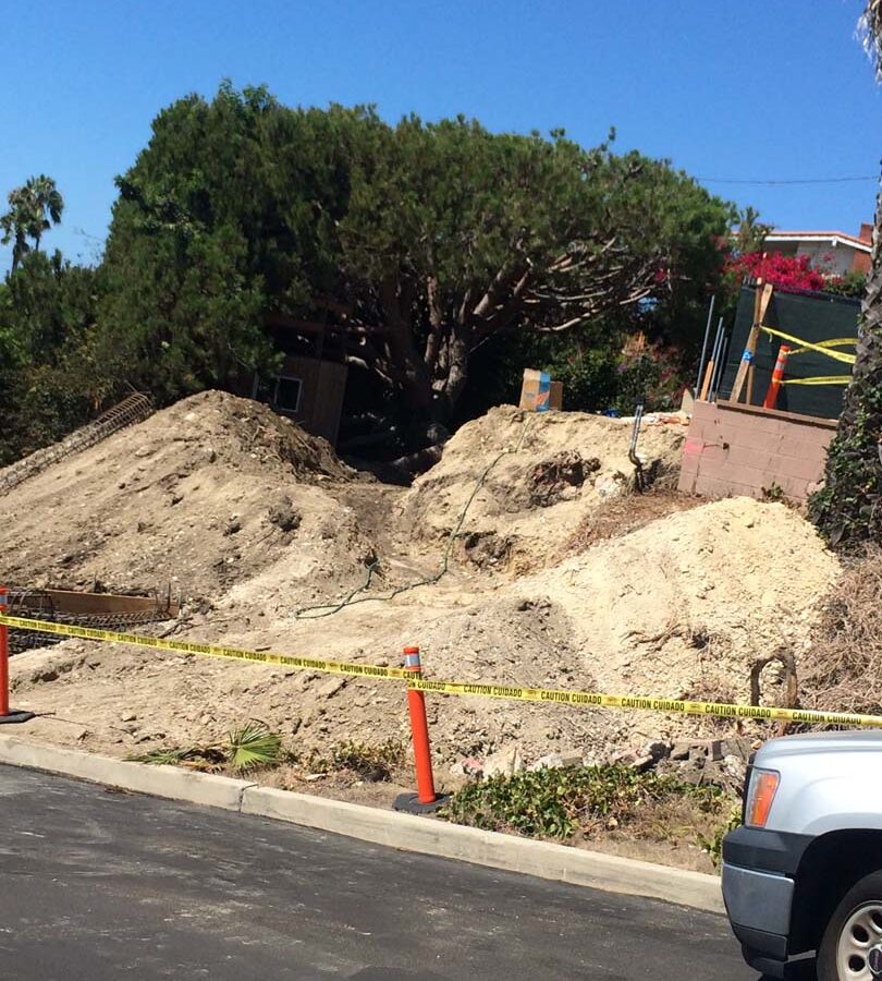Preparing the area that will serve as the new retaining wall’s foundation. Pacificland Constructors