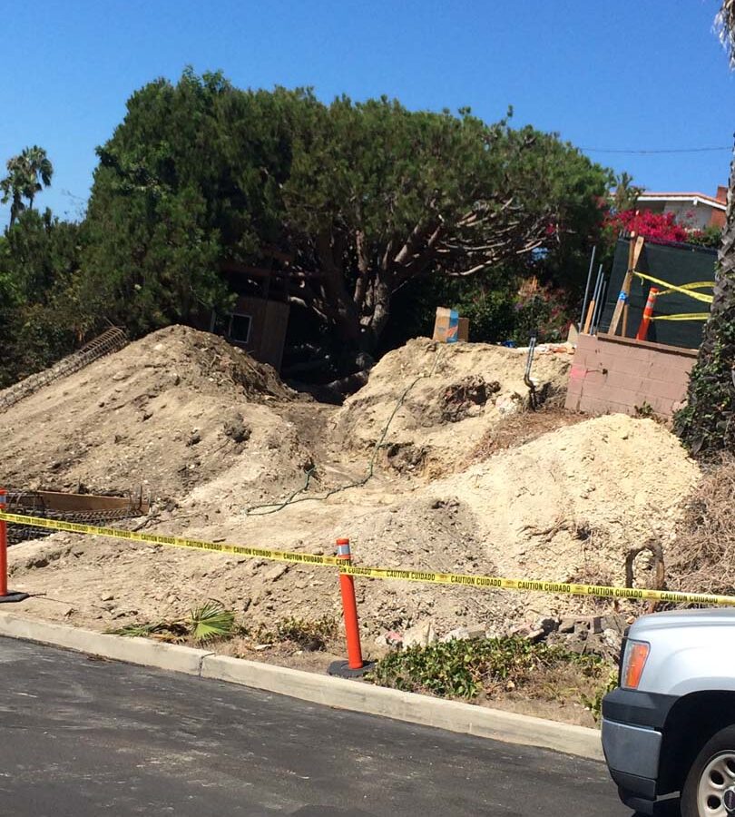 Preparing the area that will serve as the new retaining wall’s foundation. Pacificland Constructors