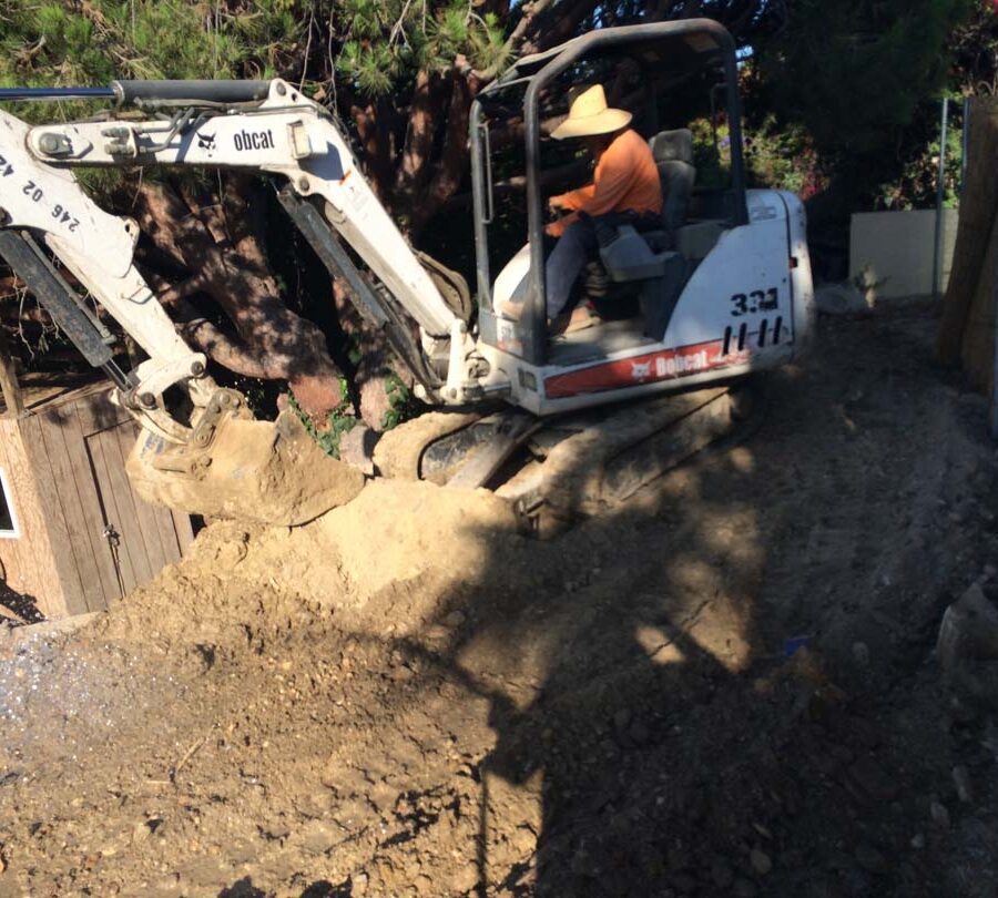 Preparing the area that will serve as the new retaining wall’s foundation. Pacificland Constructors