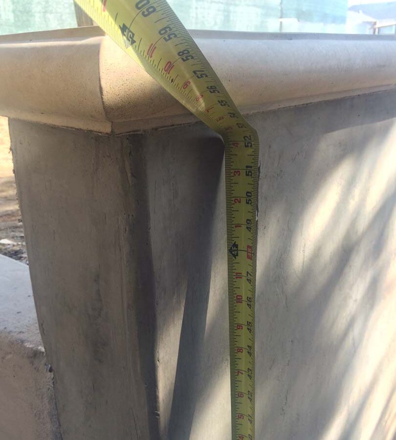 Construction of a new retaining wall with a colored concrete precast. Pacificland Constructors