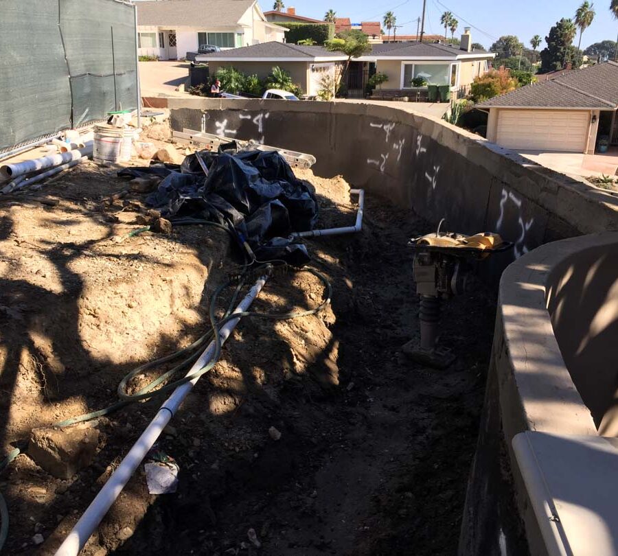 Waterproofing and pipe drainage that is buried is being compacted in place. New electrical pipe connections shown will also be buried out of sight. Pacificland Constructors